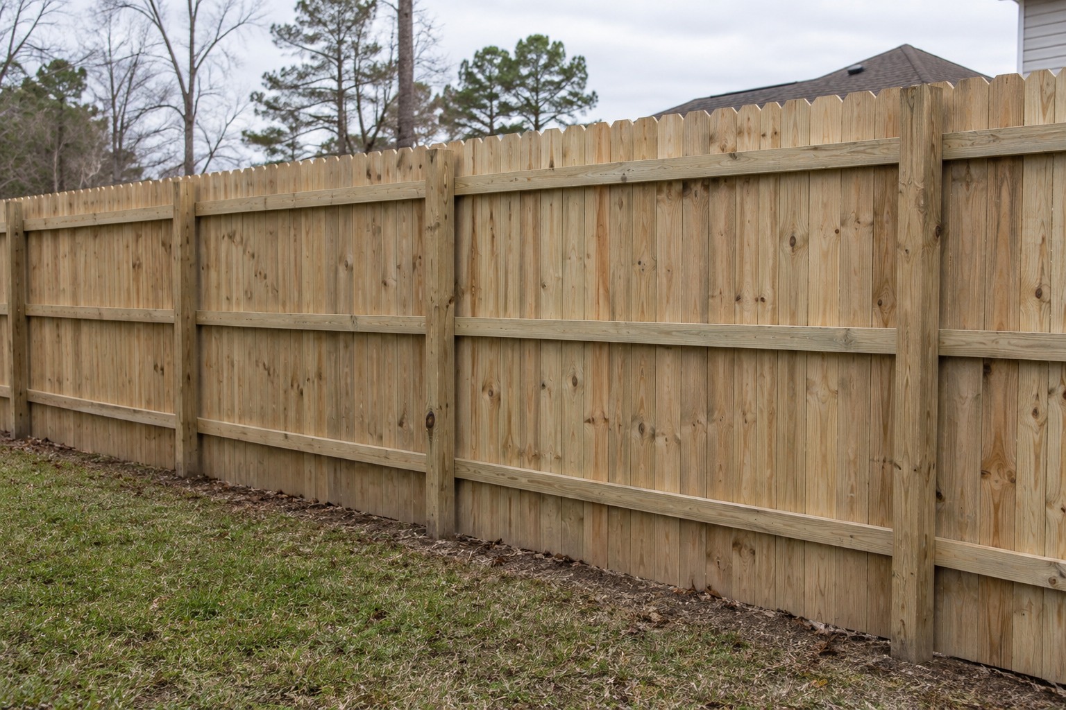 Wood privacy fence viewed from the support side